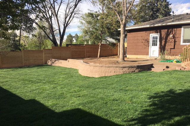 Before and after image of backyard with new fence